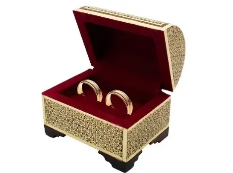 Open Persian Khatam ring box with velvet interior and symbolic rings inside