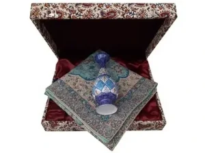 Minakari vase placed over Termeh cloth inside open presentation box