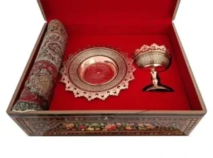 Close-up of Khatam Kari copper nut bowl and scalloped plate