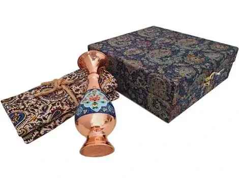 Persian copper vase on traditional Ghalamkar textile