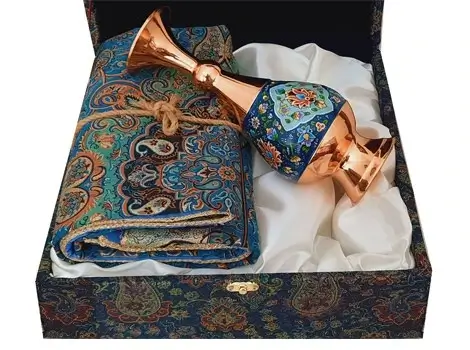 Copper vase angled on Termeh fabric inside gift box