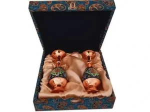Two Persian copper-painted vases inside a decorative gift box