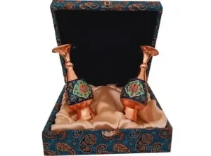 Two copper-painted vases standing inside a half-open box