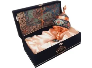 Angled view of Termeh and copper bonbon dish in gift box